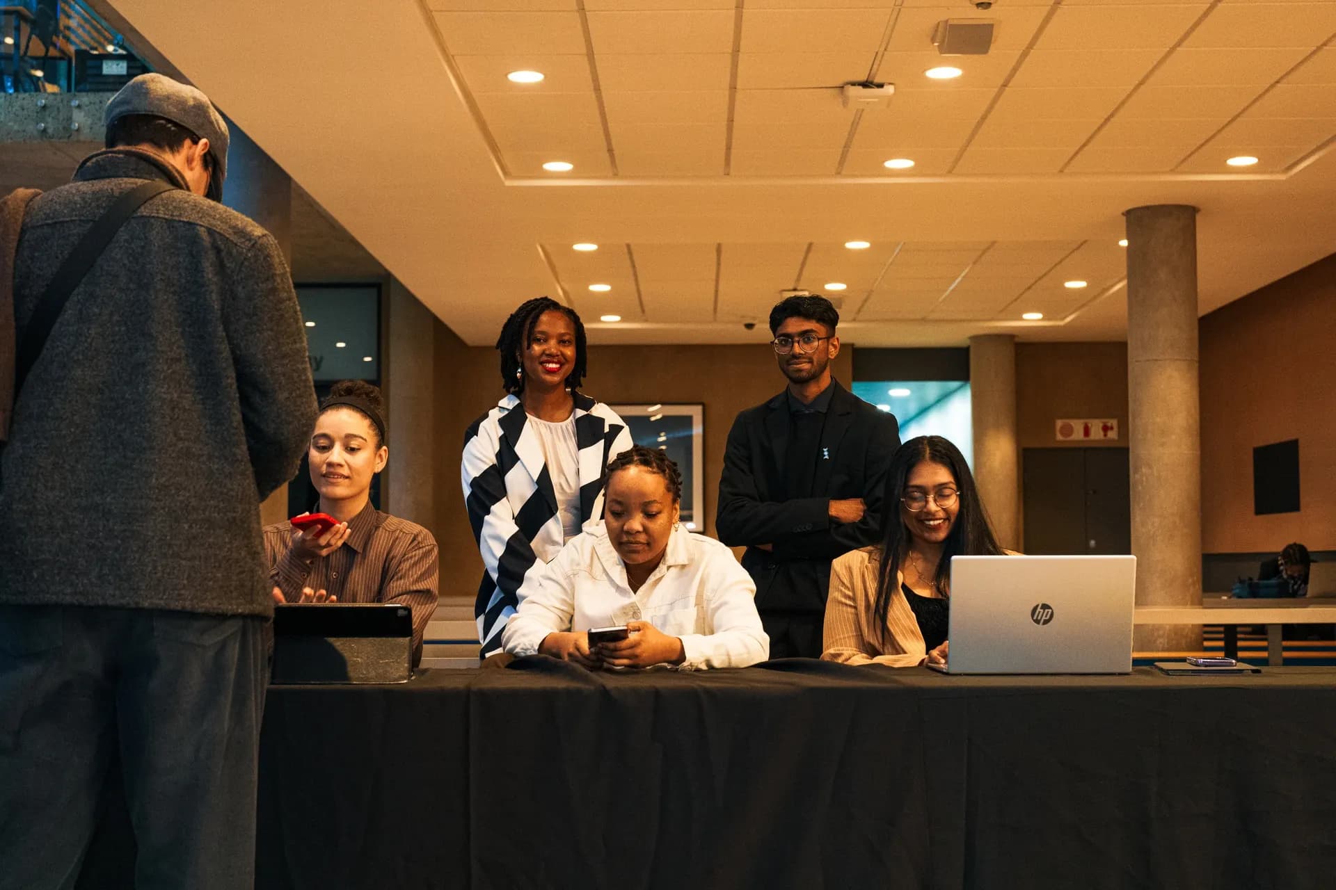 ARS members welcoming attendees at the annual general meeting registration desk